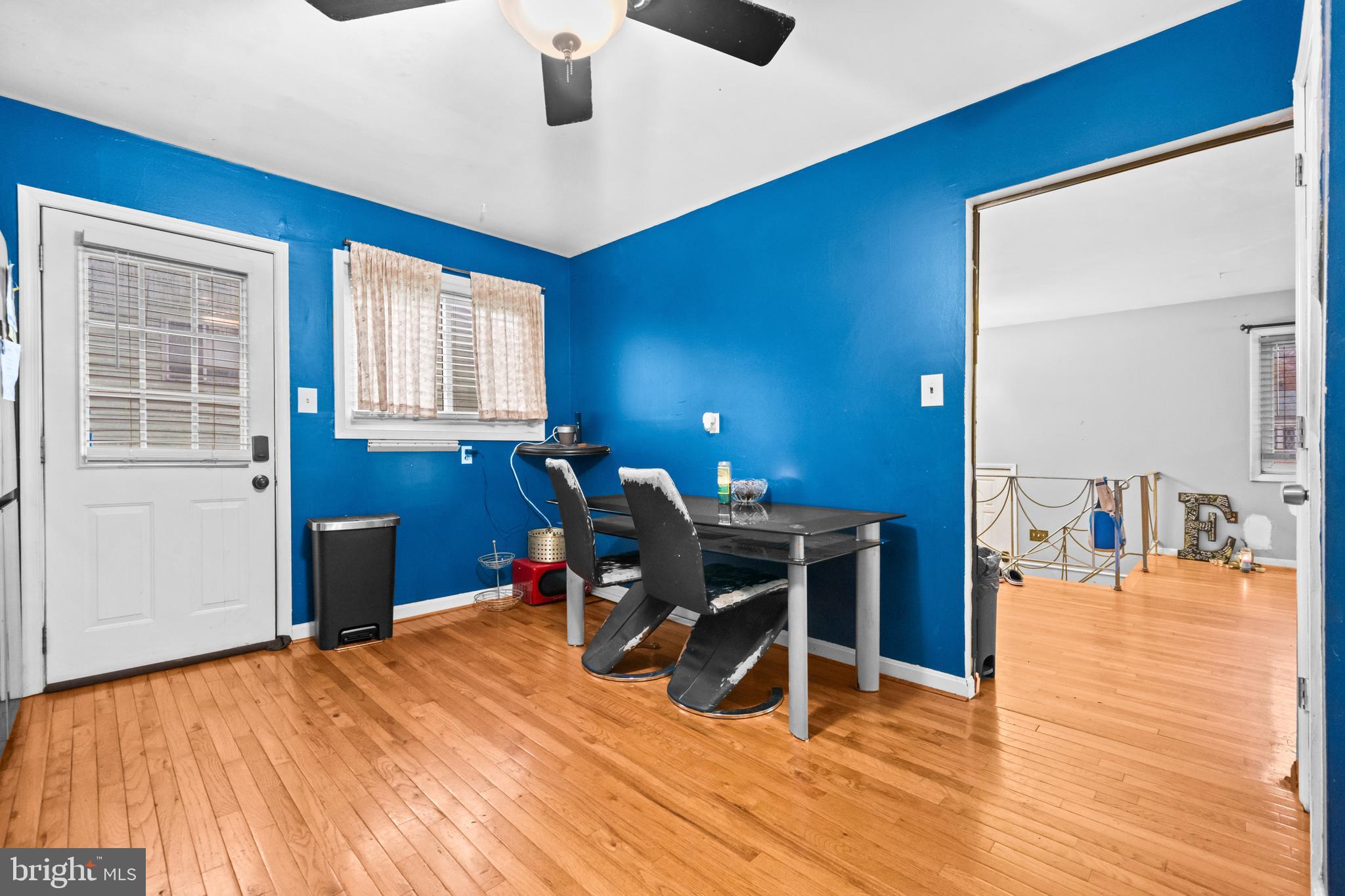 8906 Scheurer Street Lanham, MD 20706 - Photo 10 of 21 a workspace with furniture wooden floor and windows