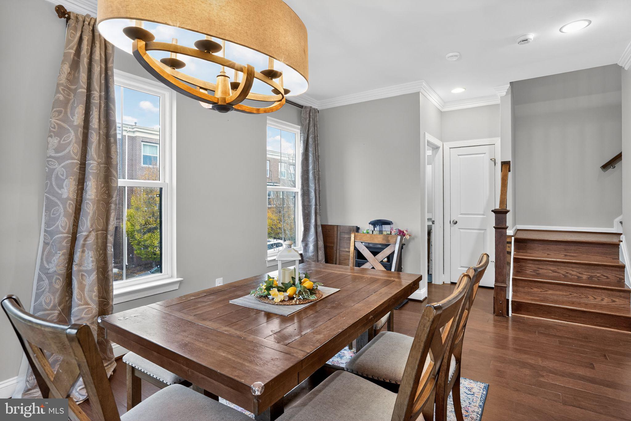 42239 Riggins Ridge Terrace Brambleton, VA 20148 - Photo 14 of 30 a view of a dining room with furniture and wooden floor
