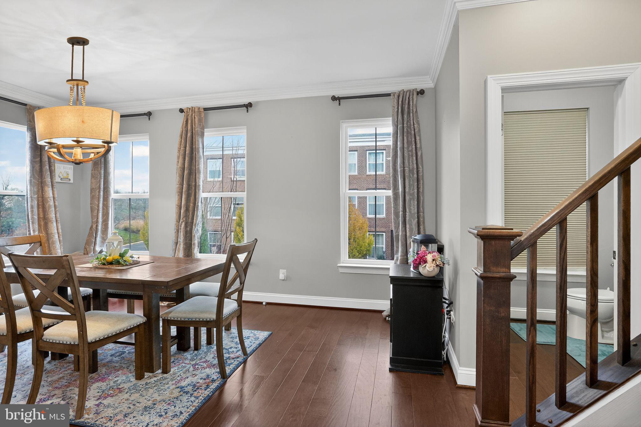 42239 Riggins Ridge Terrace Brambleton, VA 20148 - Photo 15 of 30 a view of a dining room with furniture window and wooden floor