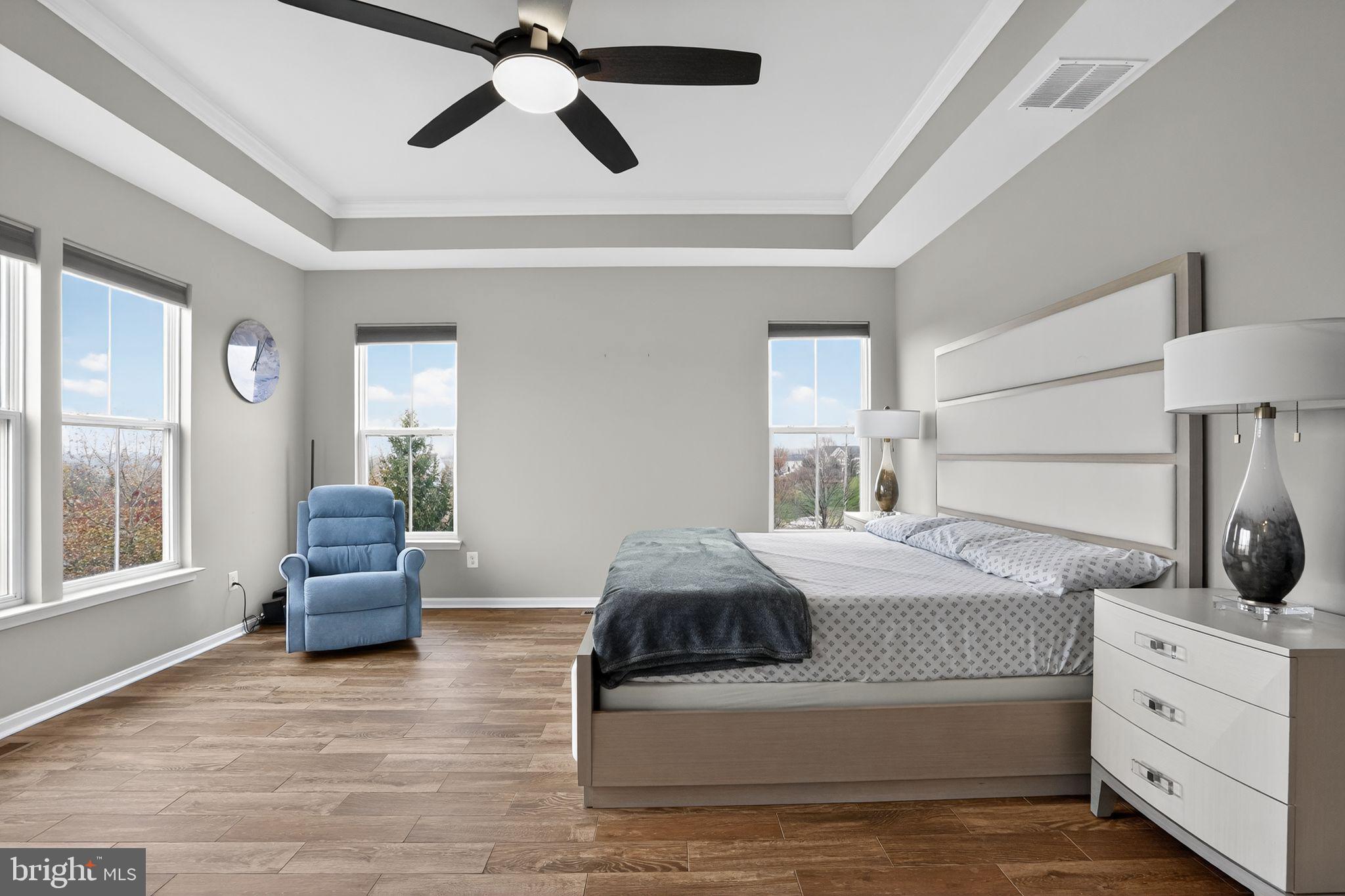 42239 Riggins Ridge Terrace Brambleton, VA 20148 - Photo 17 of 30 a bedroom with a bed and a couch