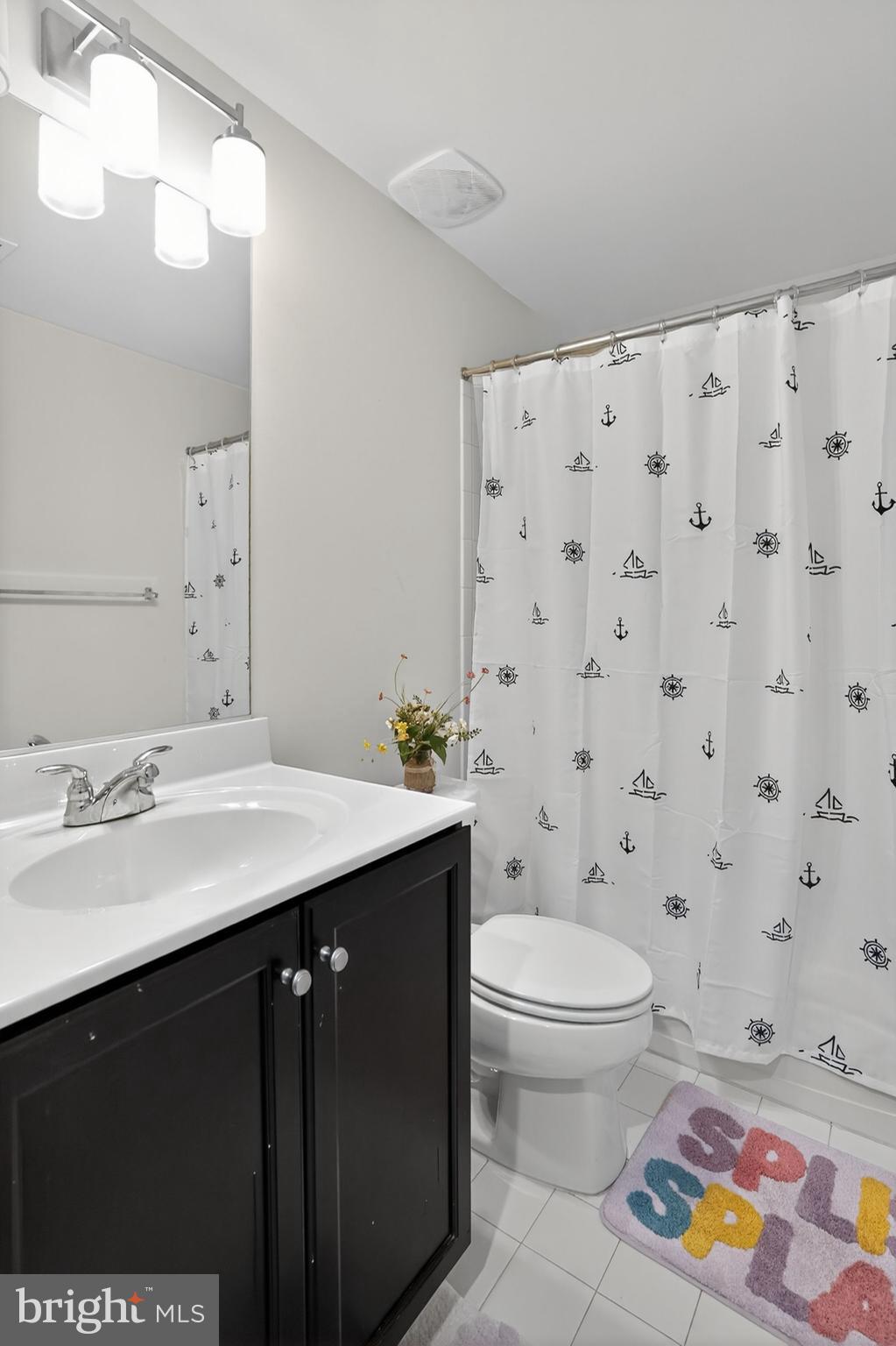 42239 Riggins Ridge Terrace Brambleton, VA 20148 - Photo 22 of 30 a bathroom with a sink a toilet and a mirror