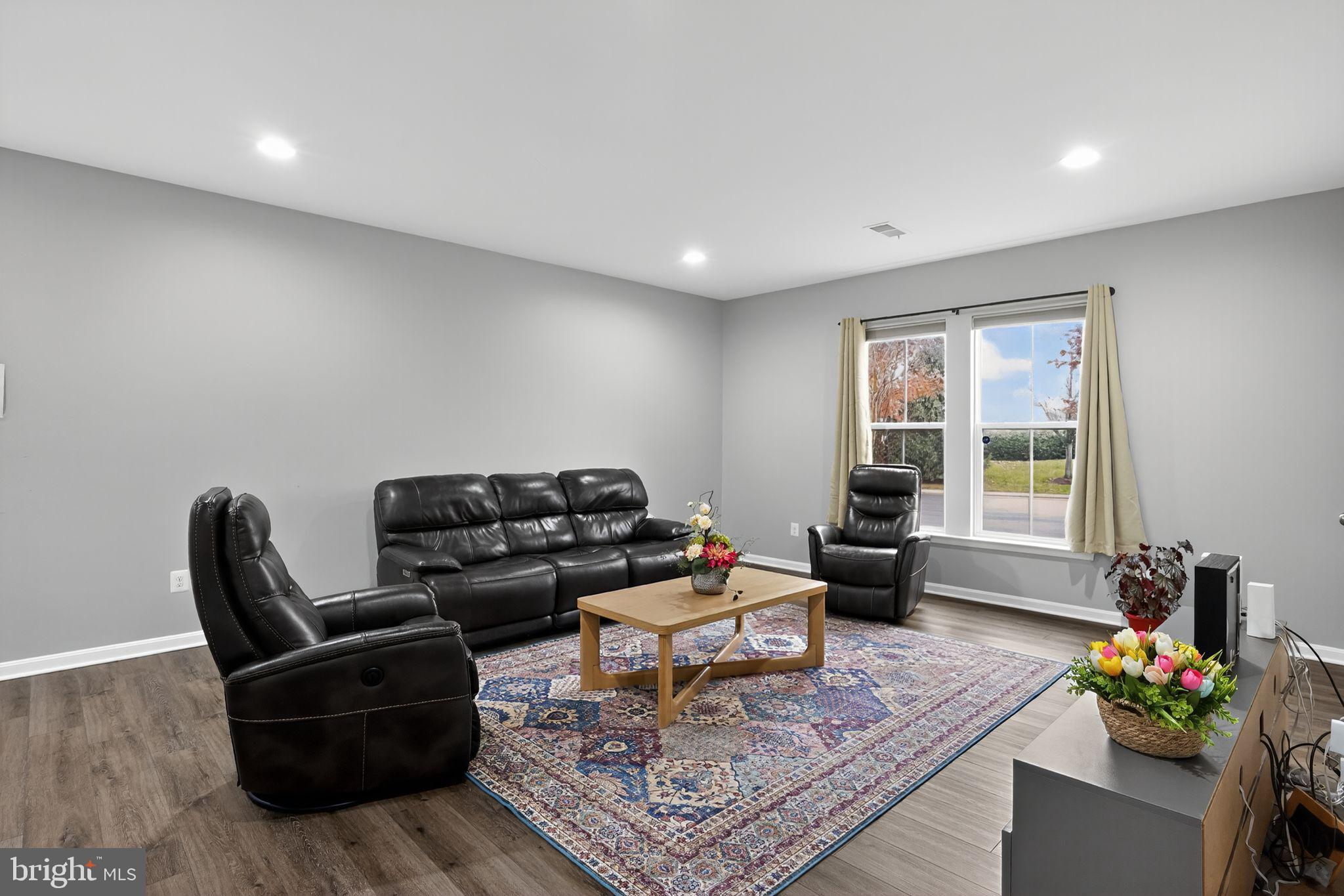 42239 Riggins Ridge Terrace Brambleton, VA 20148 - Photo 24 of 30 a living room with furniture and a potted plant