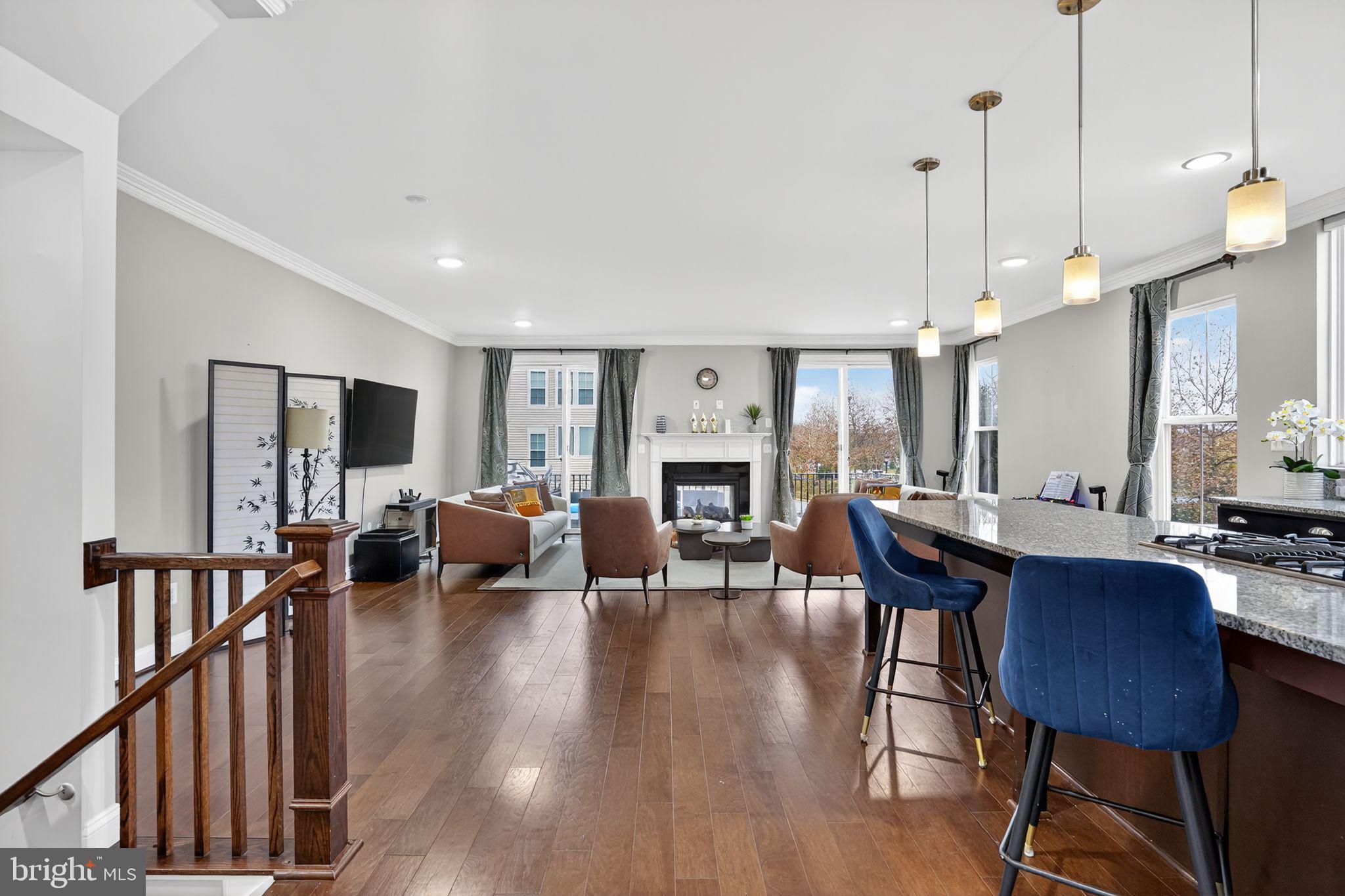 42239 Riggins Ridge Terrace Brambleton, VA 20148 - Photo 5 of 30 a view of a dining room with furniture window and wooden floor