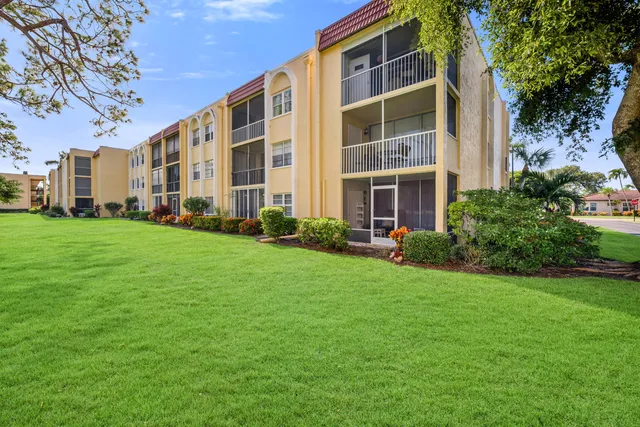 a front view of a building with garden