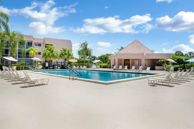 a view of swimming pool with seating space