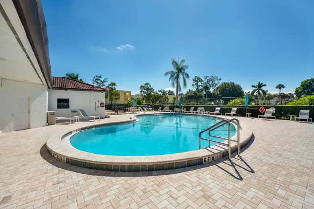 an aerial view of a house with a yard and potted plants