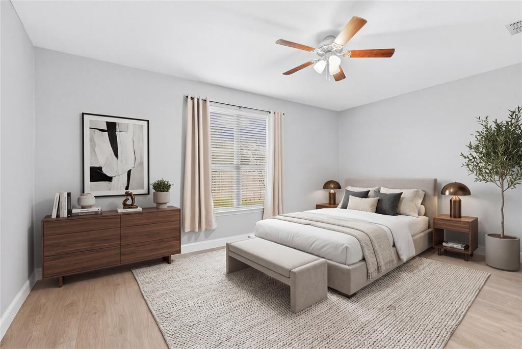 1514 Hanover Lane Van Alstyne, TX 75495 - Photo 24 of 39 a bedroom with a bed and ceiling fan