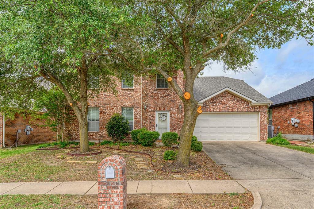 1514 Hanover Lane Van Alstyne, TX 75495 - Photo 3 of 39 a front view of a house with garden