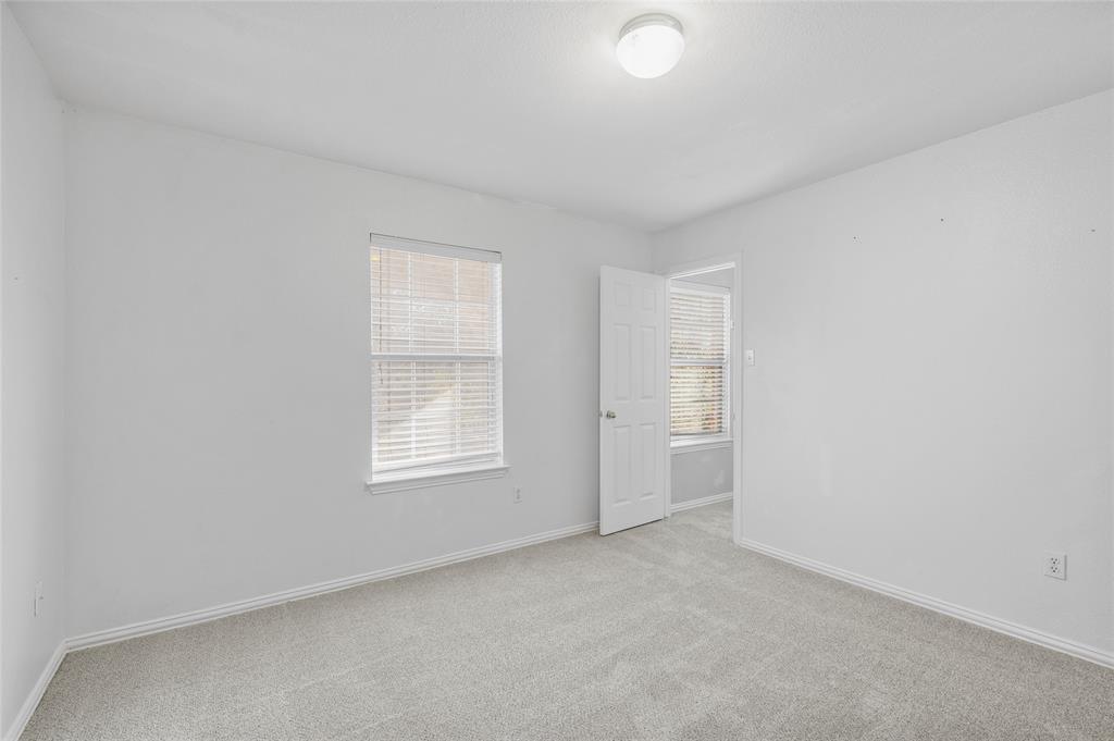 1514 Hanover Lane Van Alstyne, TX 75495 - Photo 32 of 39 an empty room with windows