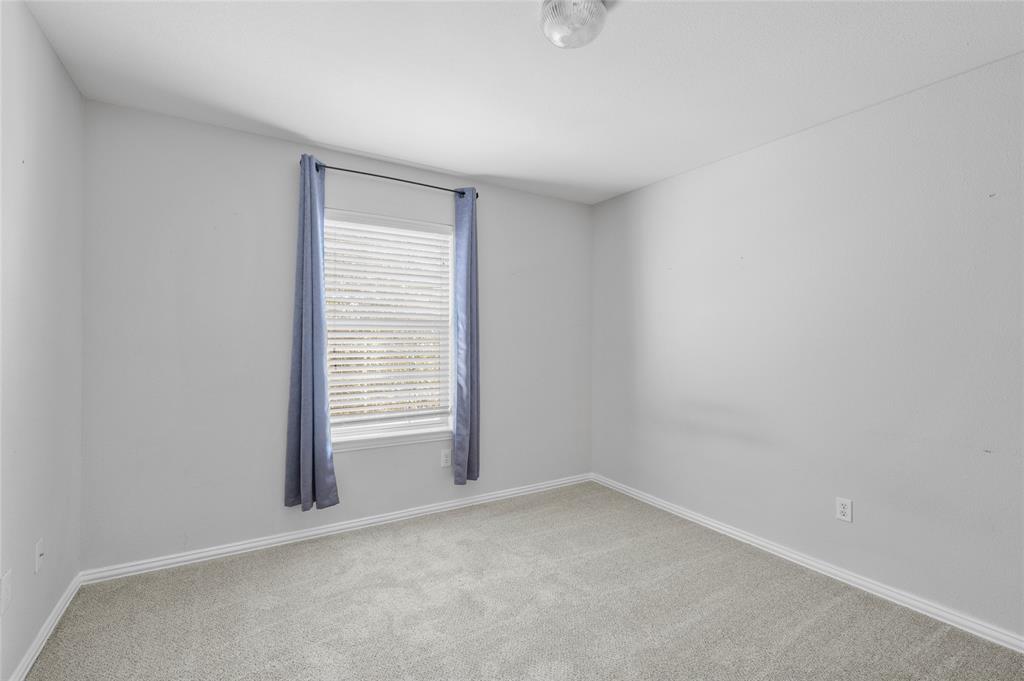 1514 Hanover Lane Van Alstyne, TX 75495 - Photo 34 of 39 a view of an empty room with a window