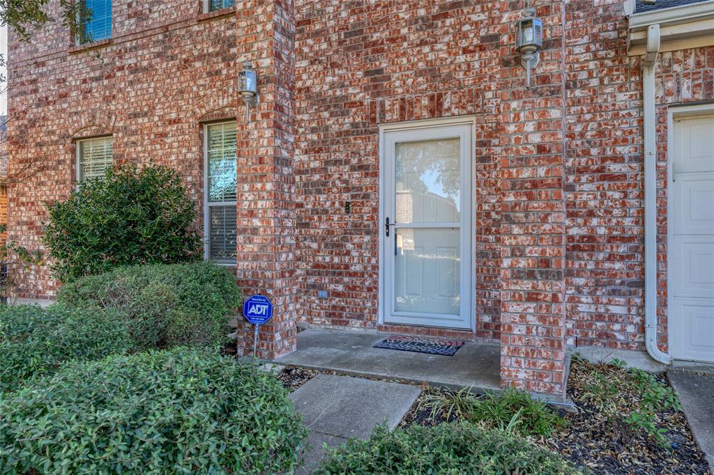 1514 Hanover Lane Van Alstyne, TX 75495 - Photo 8 of 39 front view of a brick house with a yard