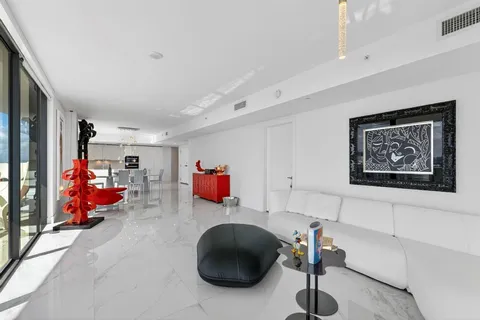 a bedroom with furniture and a chair