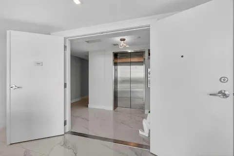 a view of sign board with flower plants