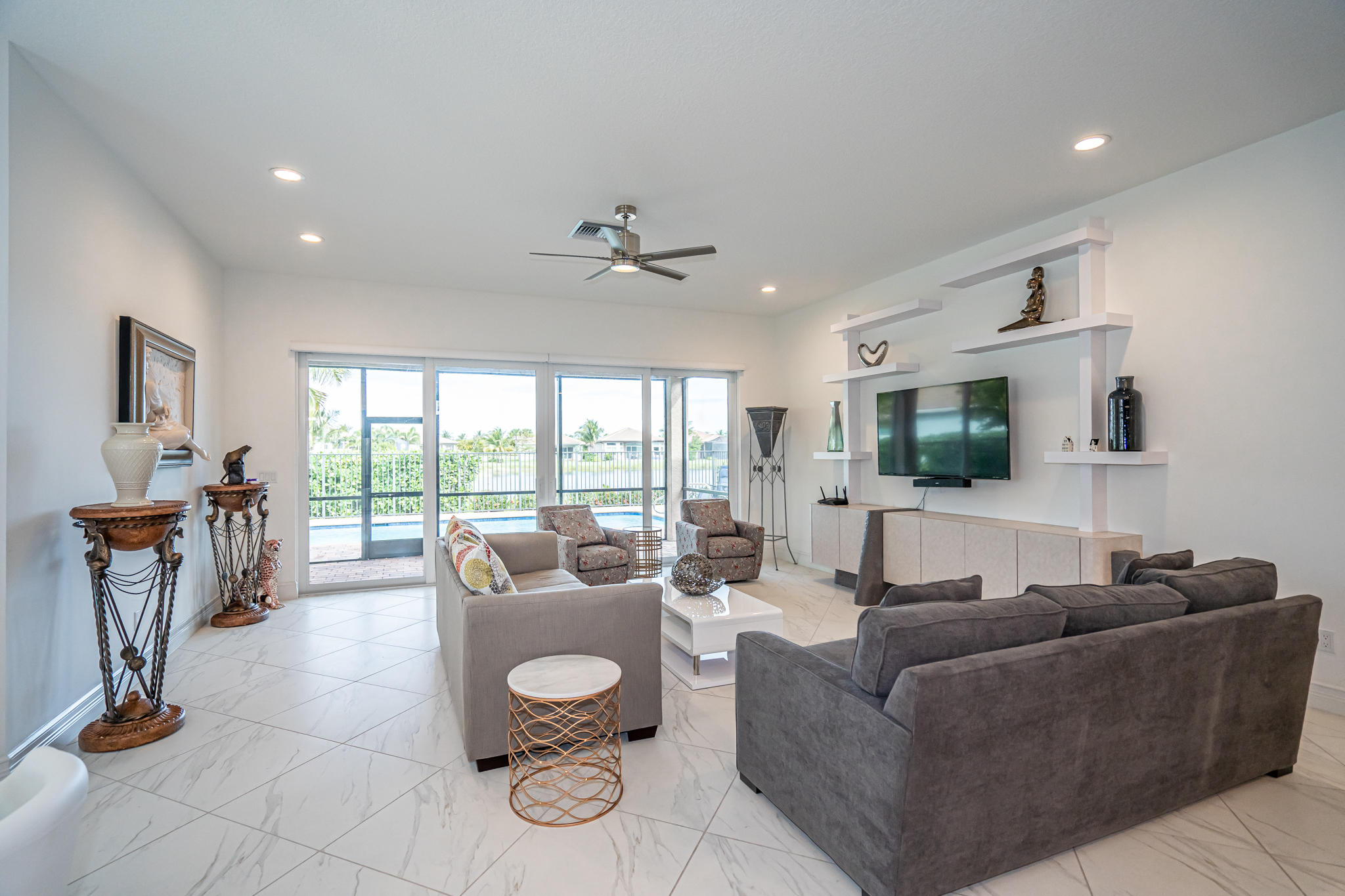 12591 Bonnington Range Drive Boynton Beach, FL 33473 - Photo 13 of 62 a living room with furniture and a flat screen tv
