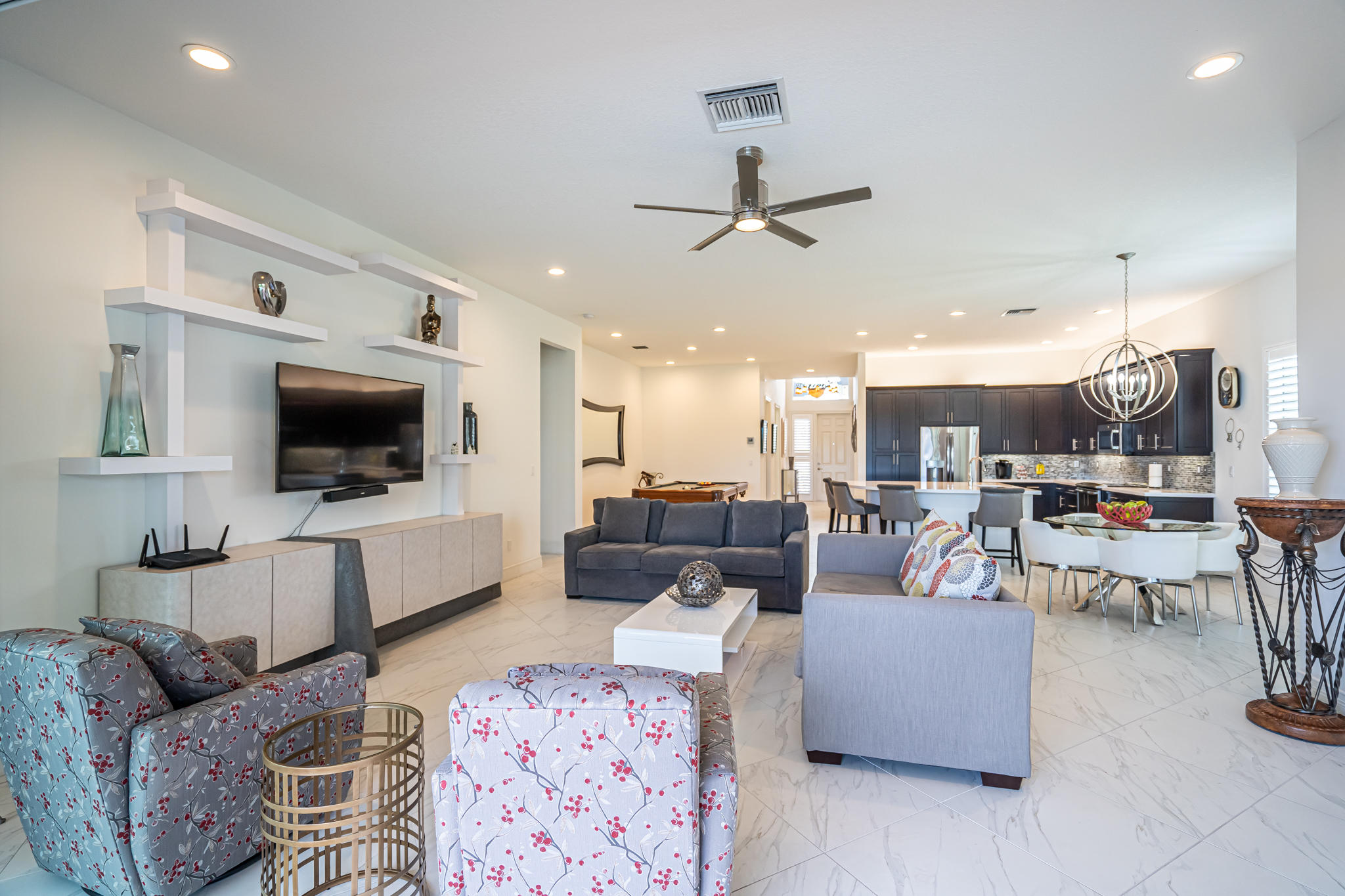 12591 Bonnington Range Drive Boynton Beach, FL 33473 - Photo 16 of 62 a living room with furniture and a flat screen tv