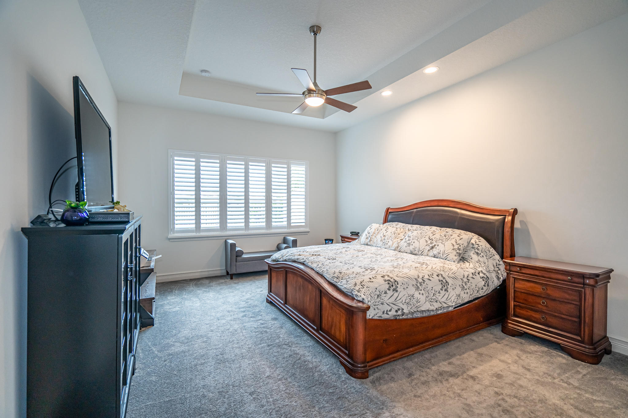 12591 Bonnington Range Drive Boynton Beach, FL 33473 - Photo 17 of 62 a bedroom with a bed and a chandelier