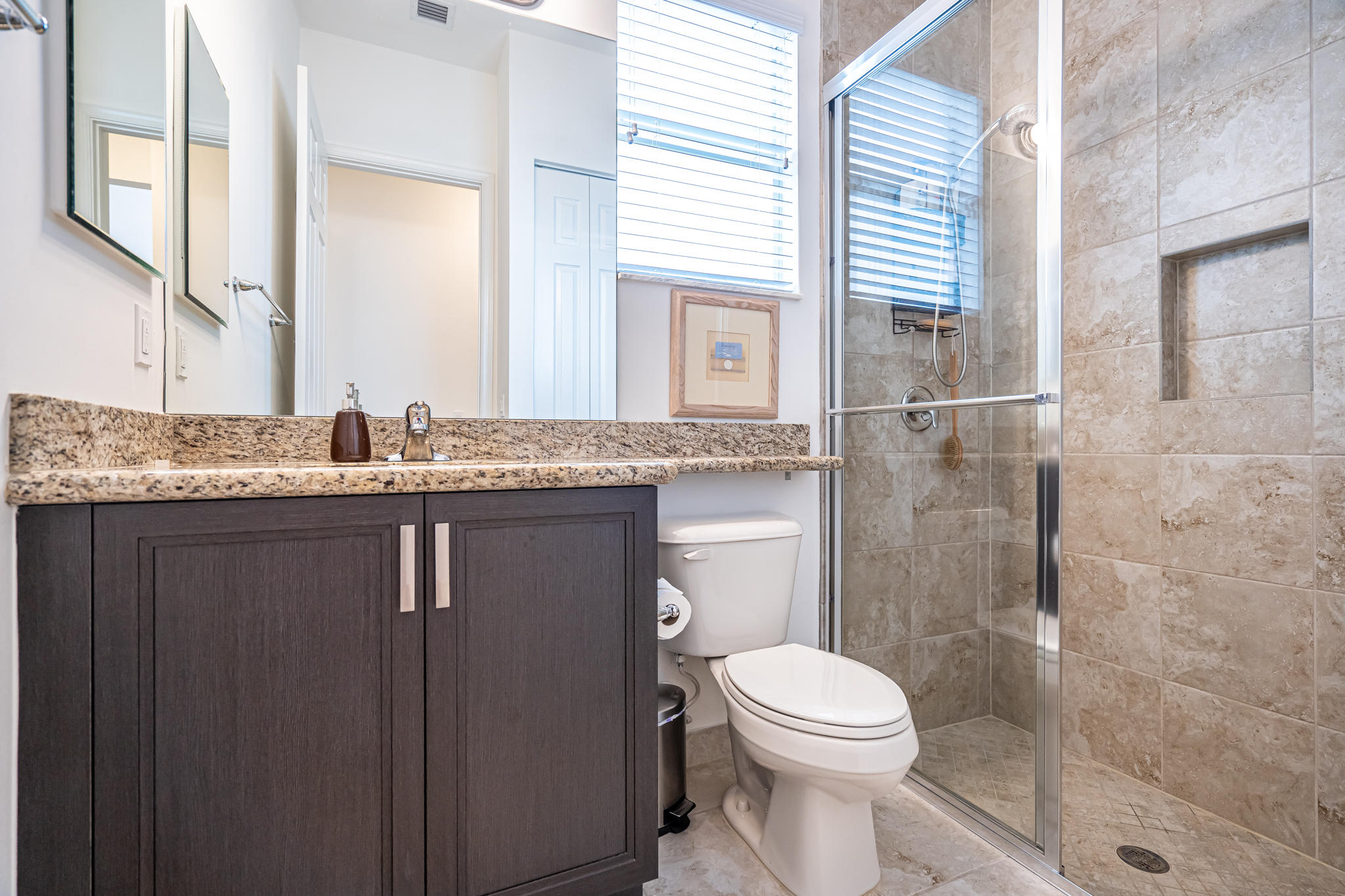 12591 Bonnington Range Drive Boynton Beach, FL 33473 - Photo 23 of 62 a bathroom with a granite countertop sink toilet and shower