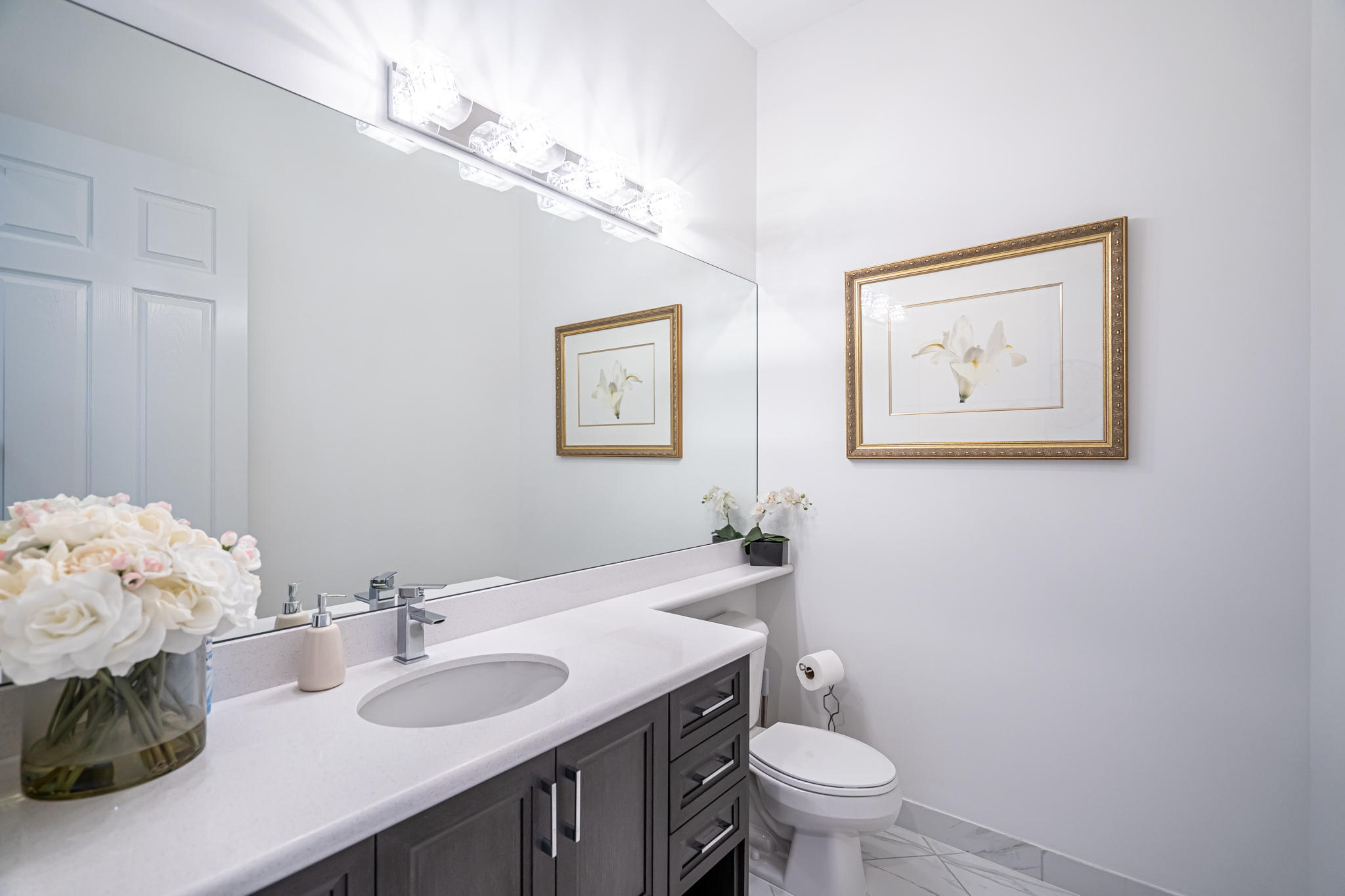 12591 Bonnington Range Drive Boynton Beach, FL 33473 - Photo 26 of 62 a bathroom with a granite countertop sink a toilet and a mirror