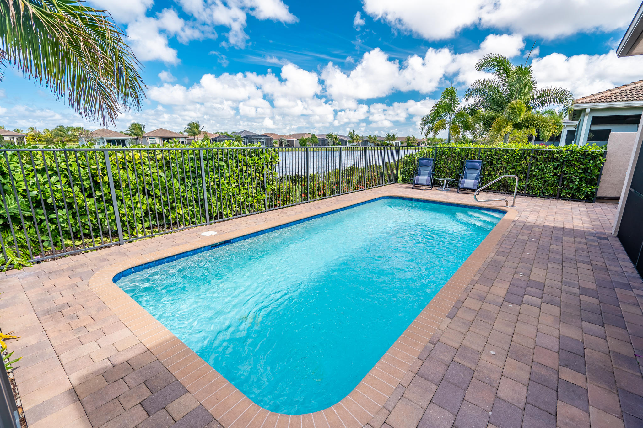 12591 Bonnington Range Drive Boynton Beach, FL 33473 - Photo 28 of 62 a view of a swimming pool with a garden