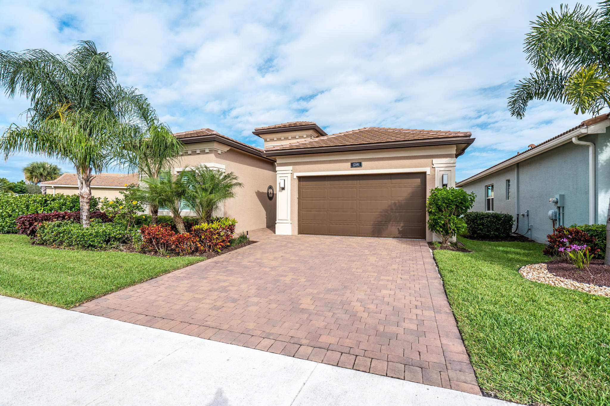 12591 Bonnington Range Drive Boynton Beach, FL 33473 - Photo 4 of 62 a front view of a house with garden