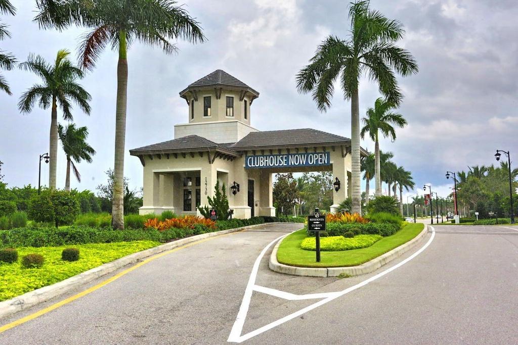 12591 Bonnington Range Drive Boynton Beach, FL 33473 - Photo 42 of 62 a view of a house with a yard and palm trees