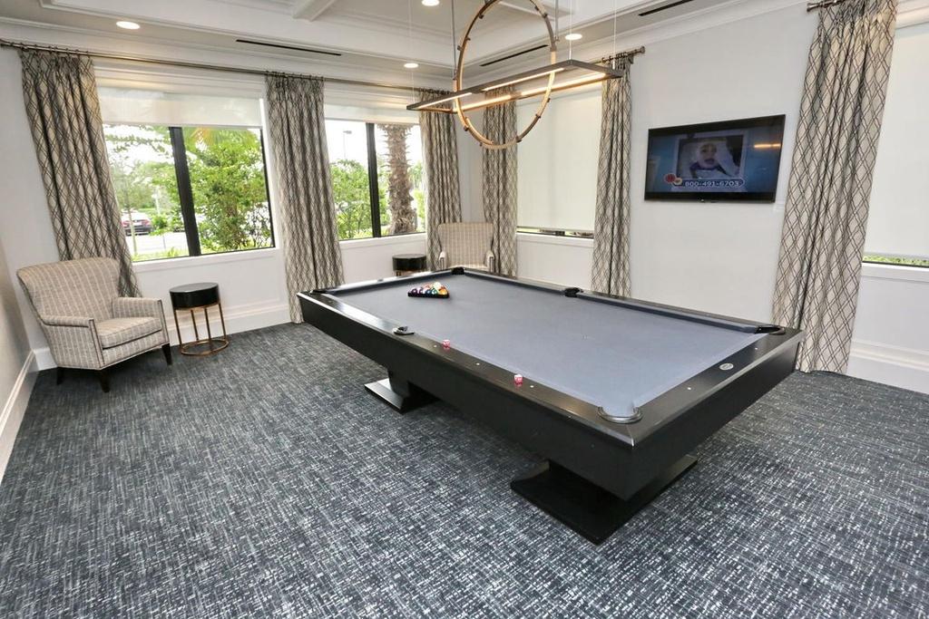 12591 Bonnington Range Drive Boynton Beach, FL 33473 - Photo 43 of 62 a living room with furniture pool table and a window