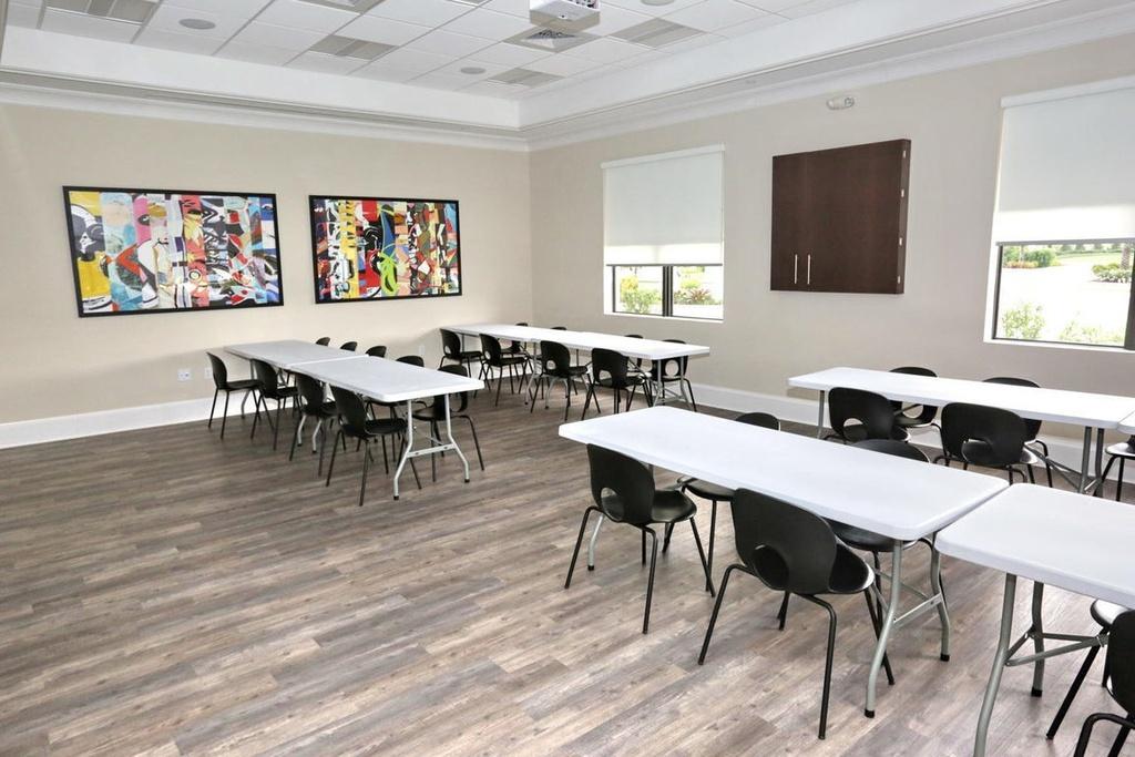 12591 Bonnington Range Drive Boynton Beach, FL 33473 - Photo 44 of 62 a view of a dining room with furniture window and wooden floor