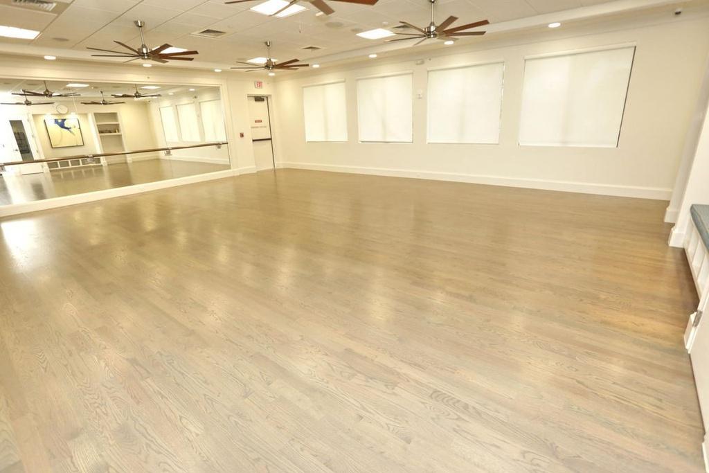 12591 Bonnington Range Drive Boynton Beach, FL 33473 - Photo 50 of 62 an empty room with wooden floor and windows