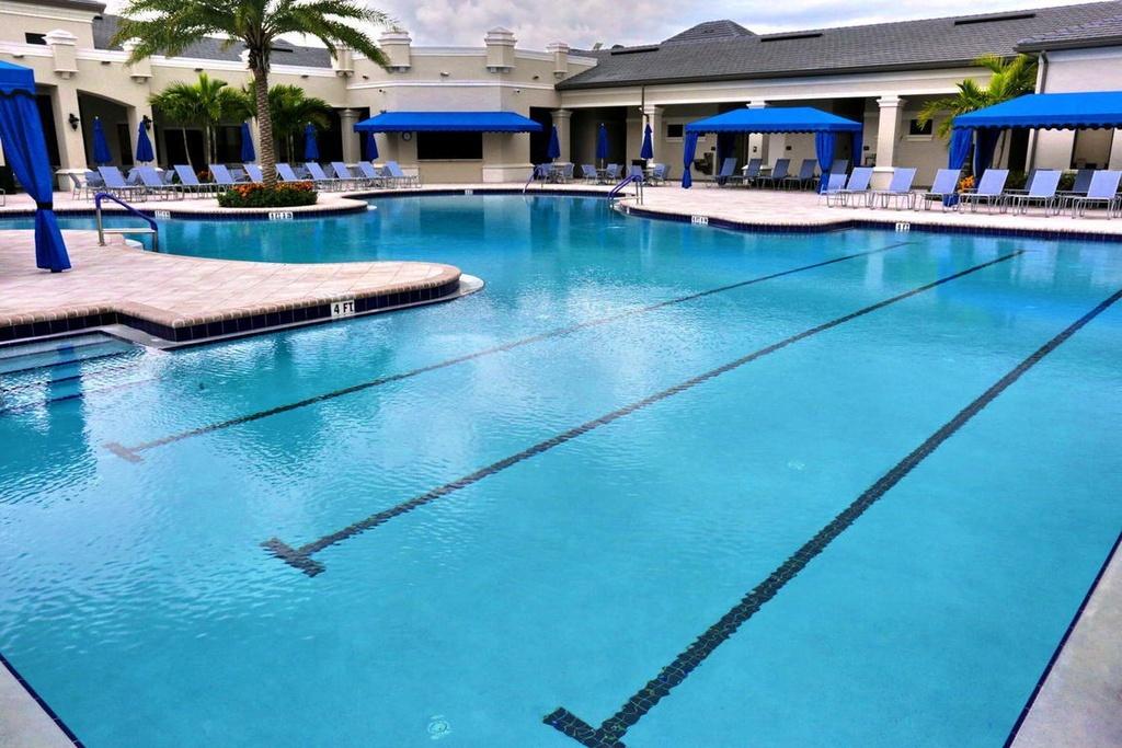 12591 Bonnington Range Drive Boynton Beach, FL 33473 - Photo 55 of 62 a view of a patio with swimming pool table and chairs