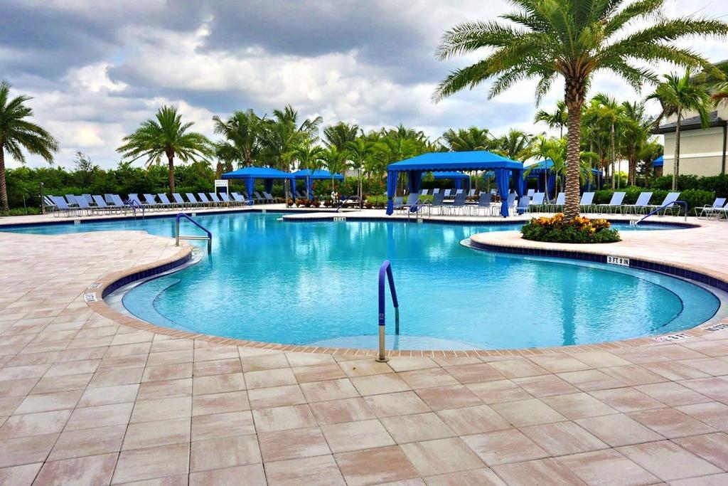 12591 Bonnington Range Drive Boynton Beach, FL 33473 - Photo 56 of 62 a view of a swimming pool and lounge chairs