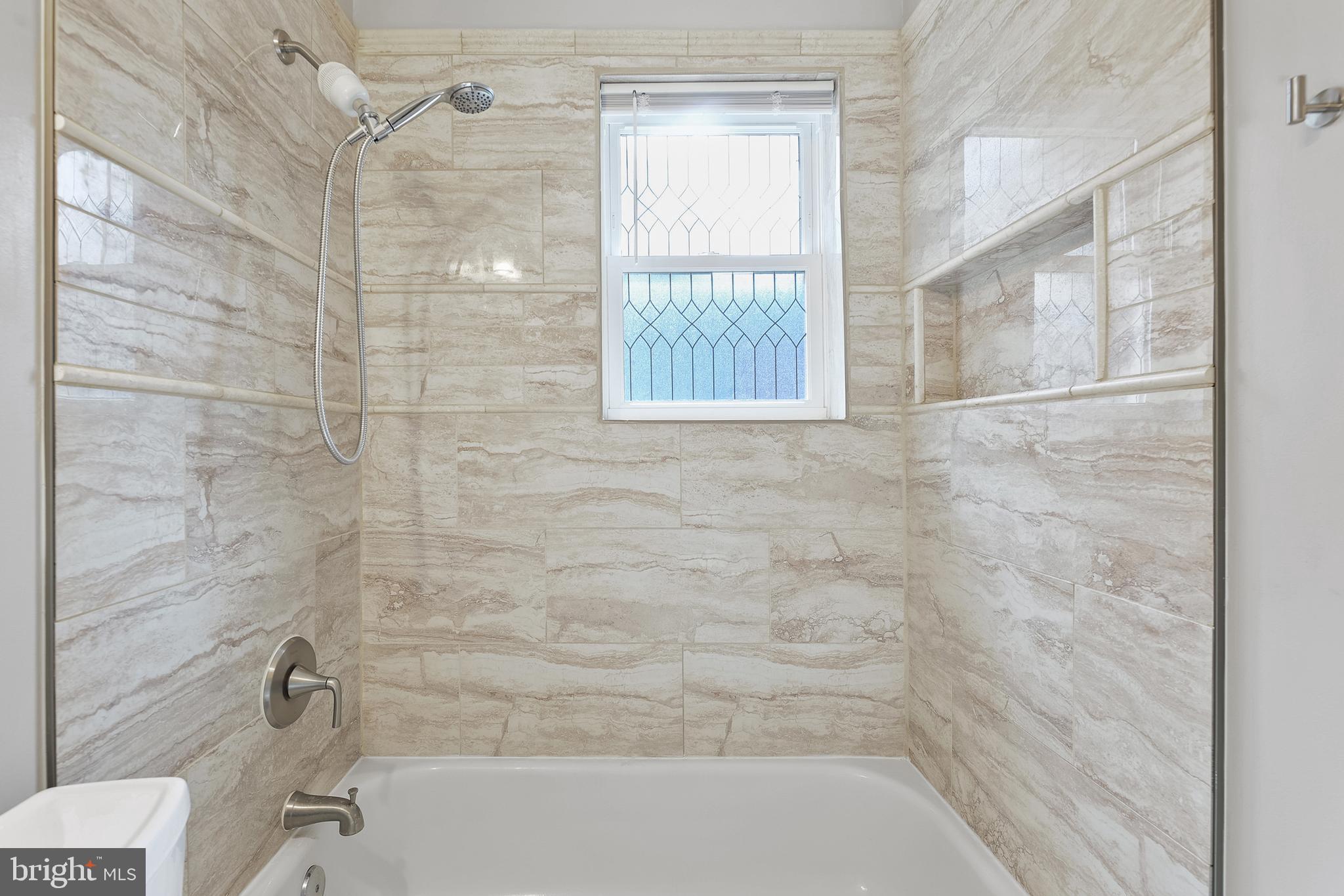 123 Walnut Street Northwest Washington, DC 20012 - Photo 18 of 38 a bathroom with a bathtub