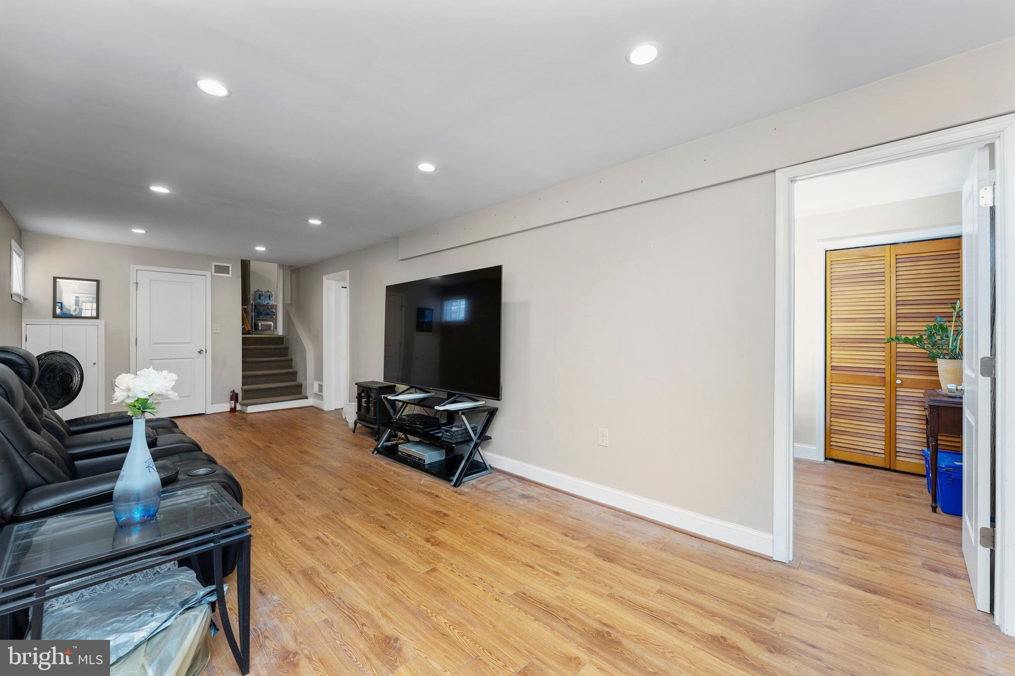 123 Walnut Street Northwest Washington, DC 20012 - Photo 25 of 38 a living room with furniture and a flat screen tv