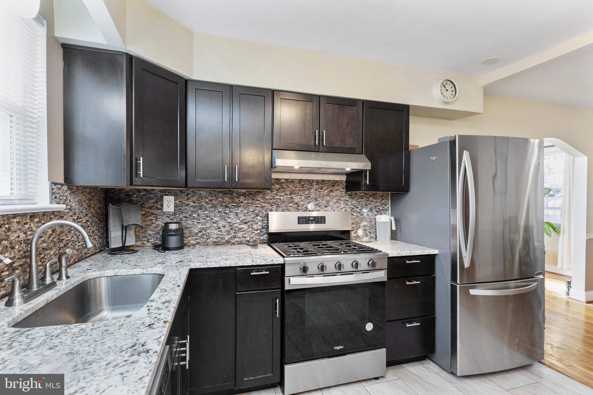 123 Walnut Street Northwest Washington, DC 20012 - Photo 3 of 38 a kitchen with a refrigerator sink and stove