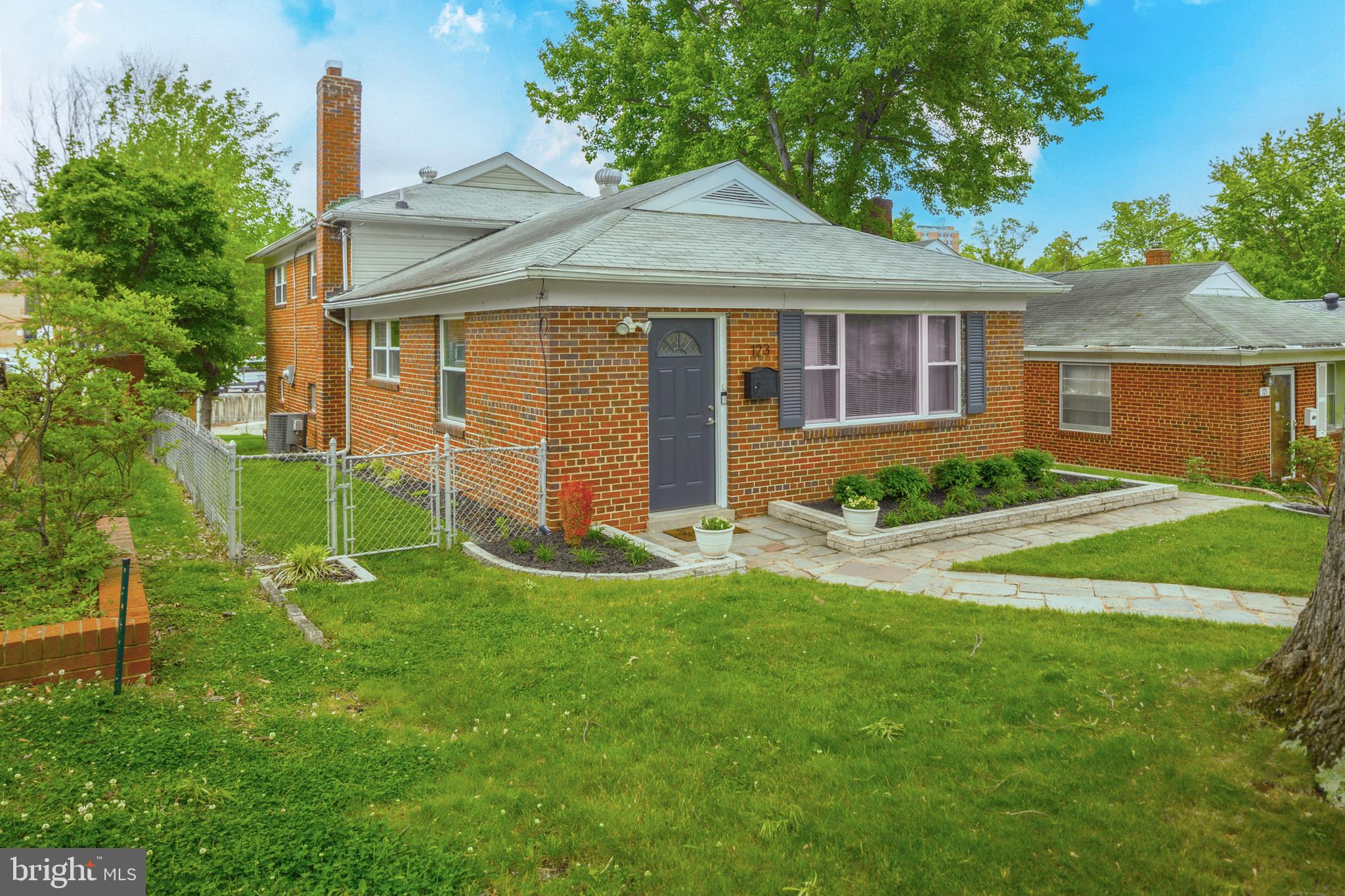 123 Walnut Street Northwest Washington, DC 20012 - Photo 10 of 38 a view of a house with a yard and plants