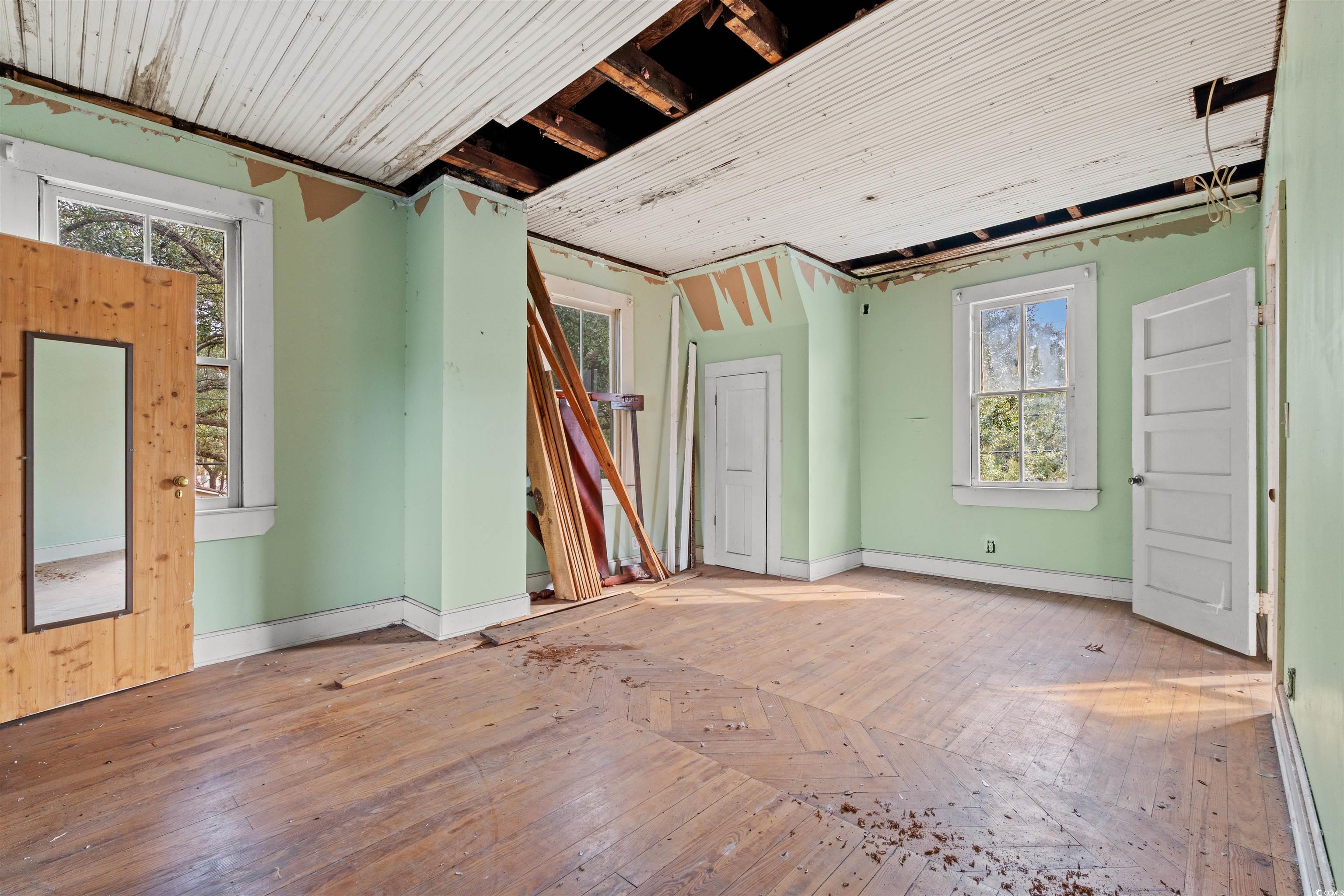 133 Wood Street Georgetown, SC 29440 - Photo 14 of 37 Unfurnished room featuring plenty of natural light and baseboard heating