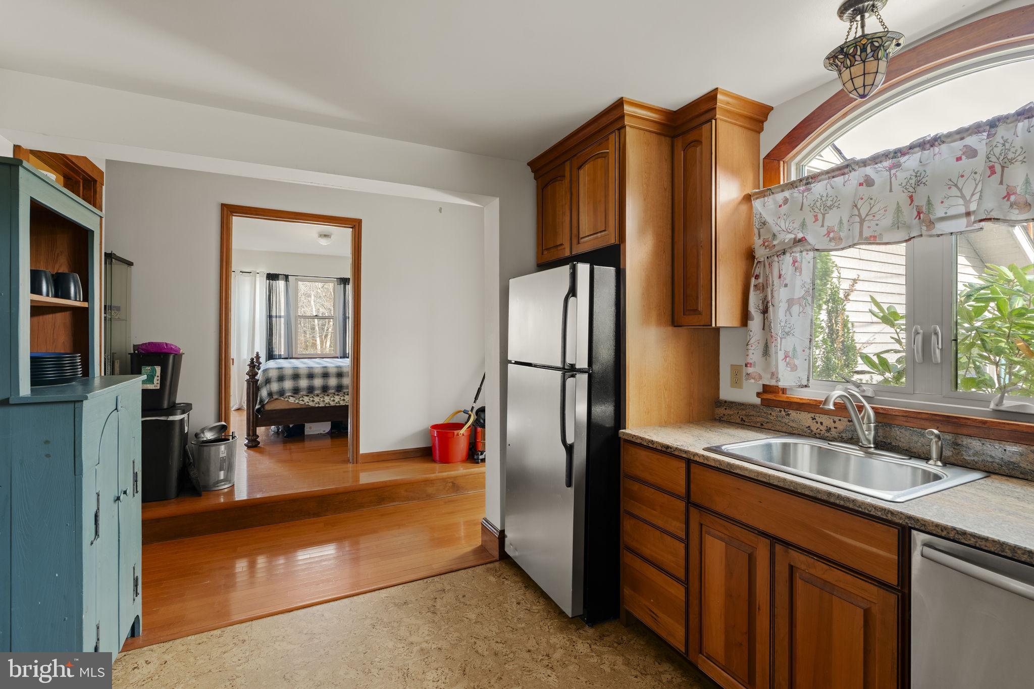 451 Pine Swamp Road Elverson, PA 19520 - Photo 12 of 91 a kitchen with stainless steel appliances granite countertop a refrigerator and a sink