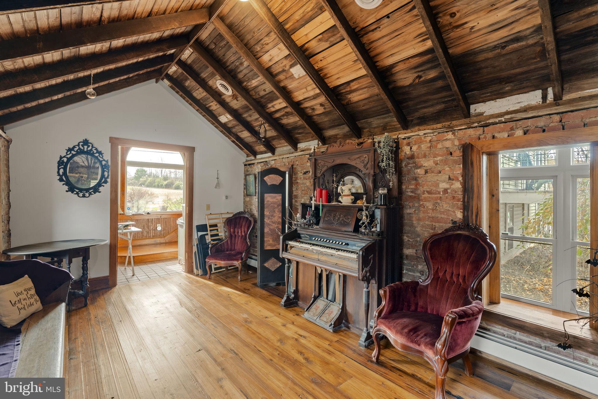 451 Pine Swamp Road Elverson, PA 19520 - Photo 26 of 91 a living room with furniture and a wooden floor