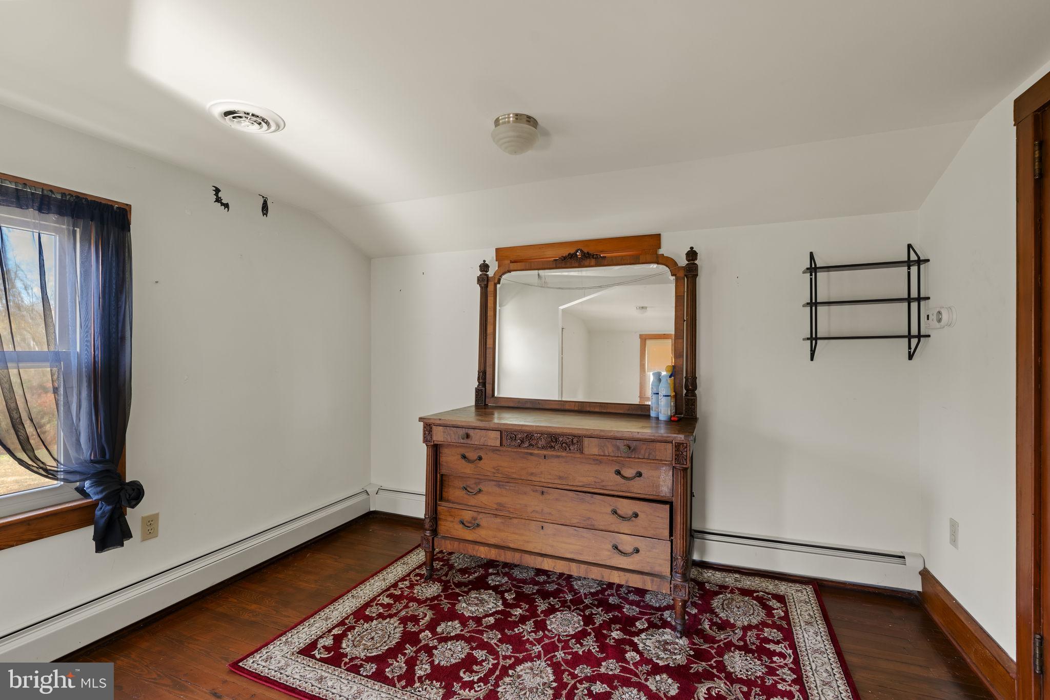 451 Pine Swamp Road Elverson, PA 19520 - Photo 33 of 91 a living room with furniture and a flat screen tv