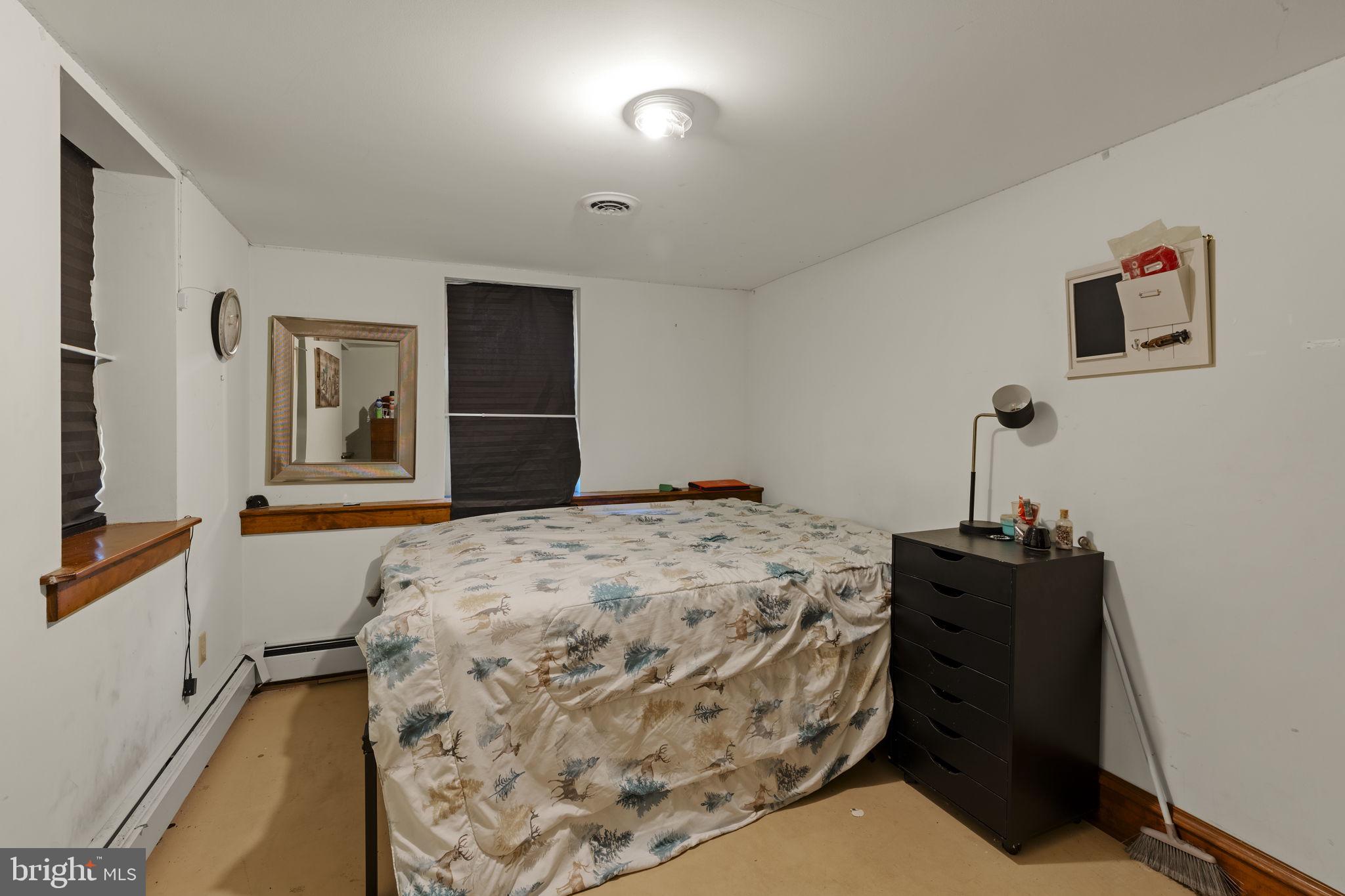 451 Pine Swamp Road Elverson, PA 19520 - Photo 39 of 91 a bedroom with a bed and a dresser