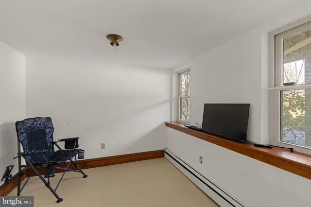a view of a roof deck with furniture and wooden floor