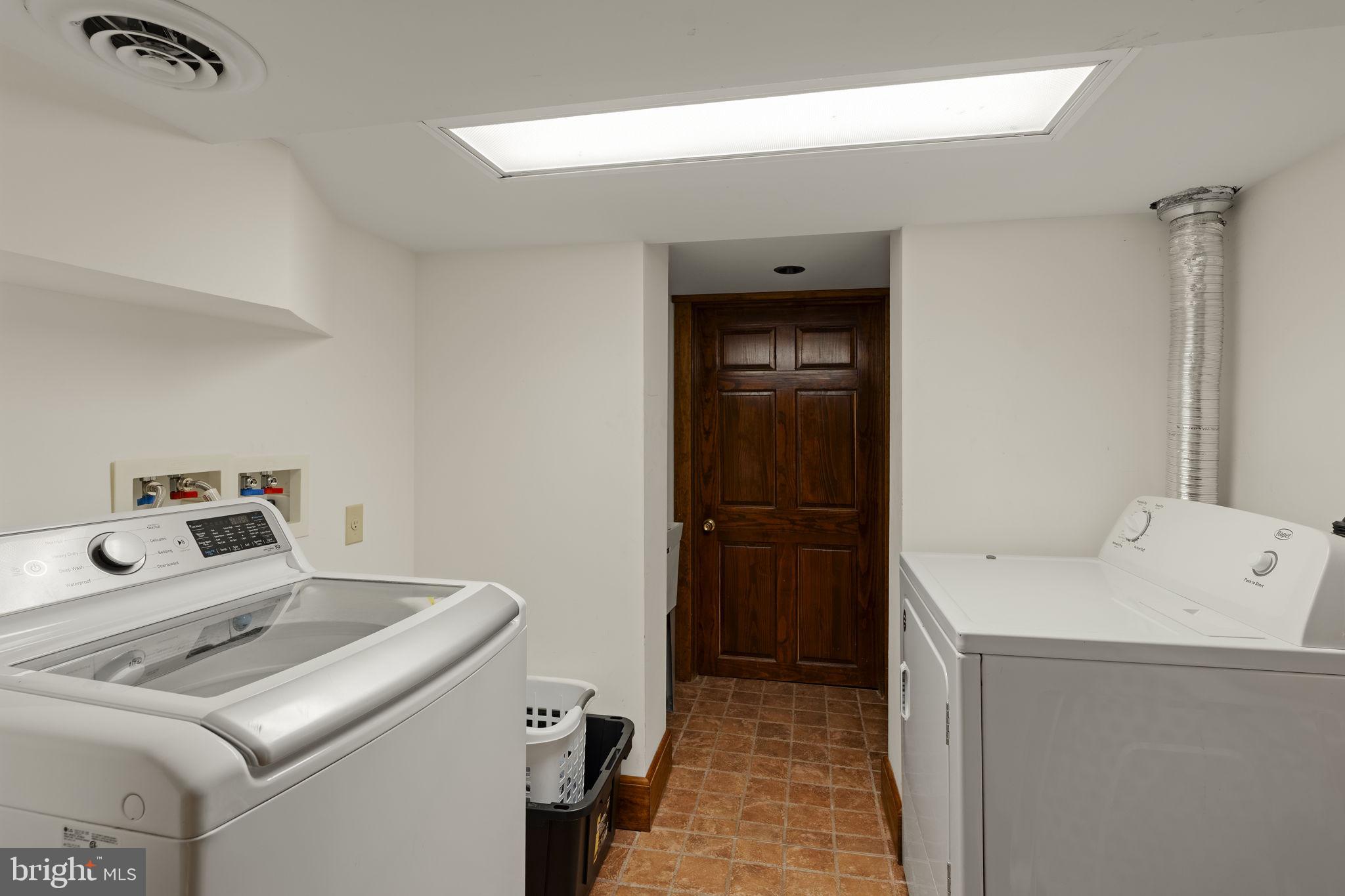 451 Pine Swamp Road Elverson, PA 19520 - Photo 44 of 91 a utility room with dryer and washer