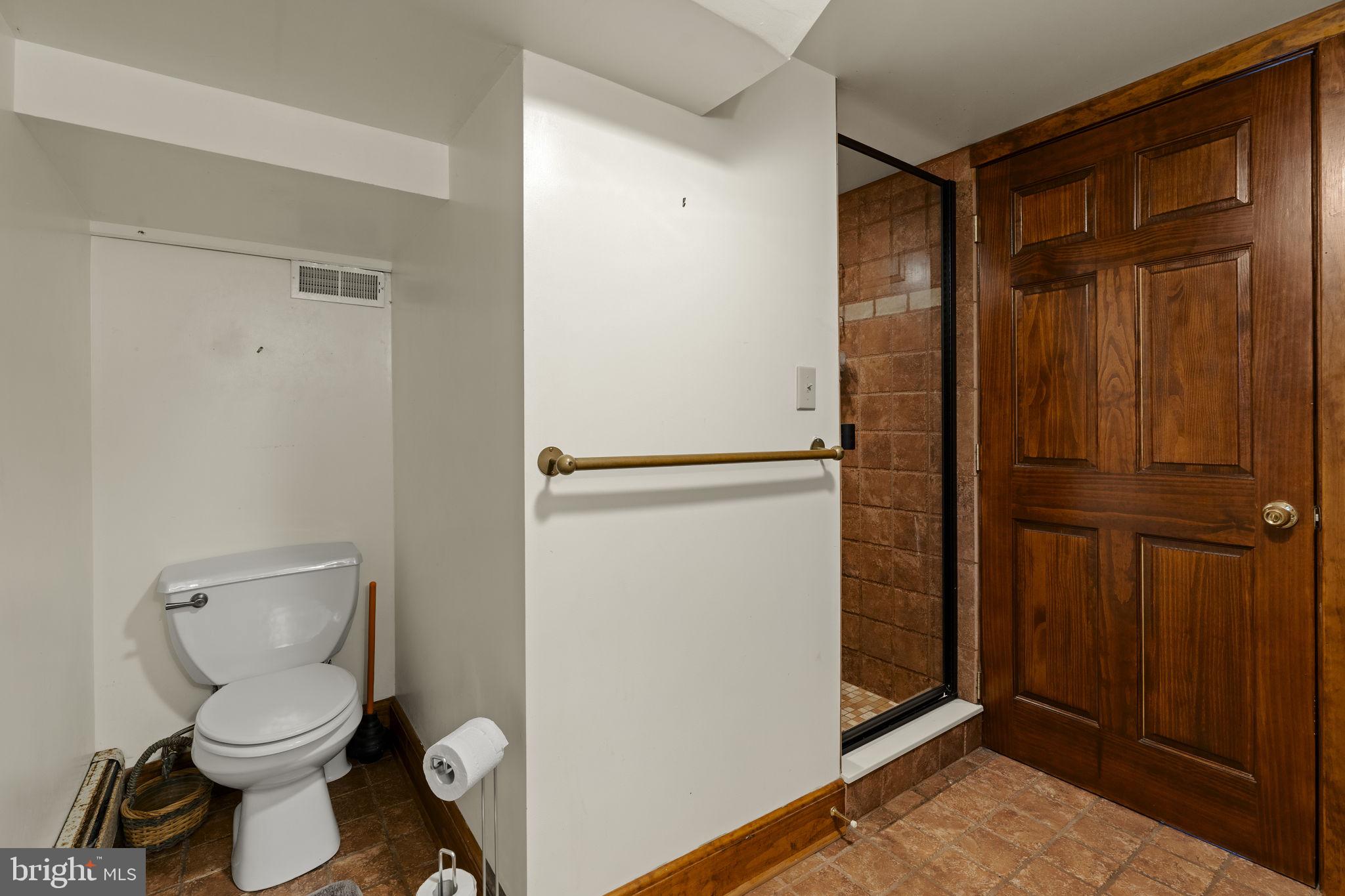451 Pine Swamp Road Elverson, PA 19520 - Photo 49 of 91 a bathroom with a toilet and a shower