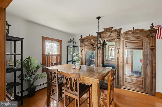 a kitchen with stainless steel appliances granite countertop a refrigerator a stove a sink and a microwave