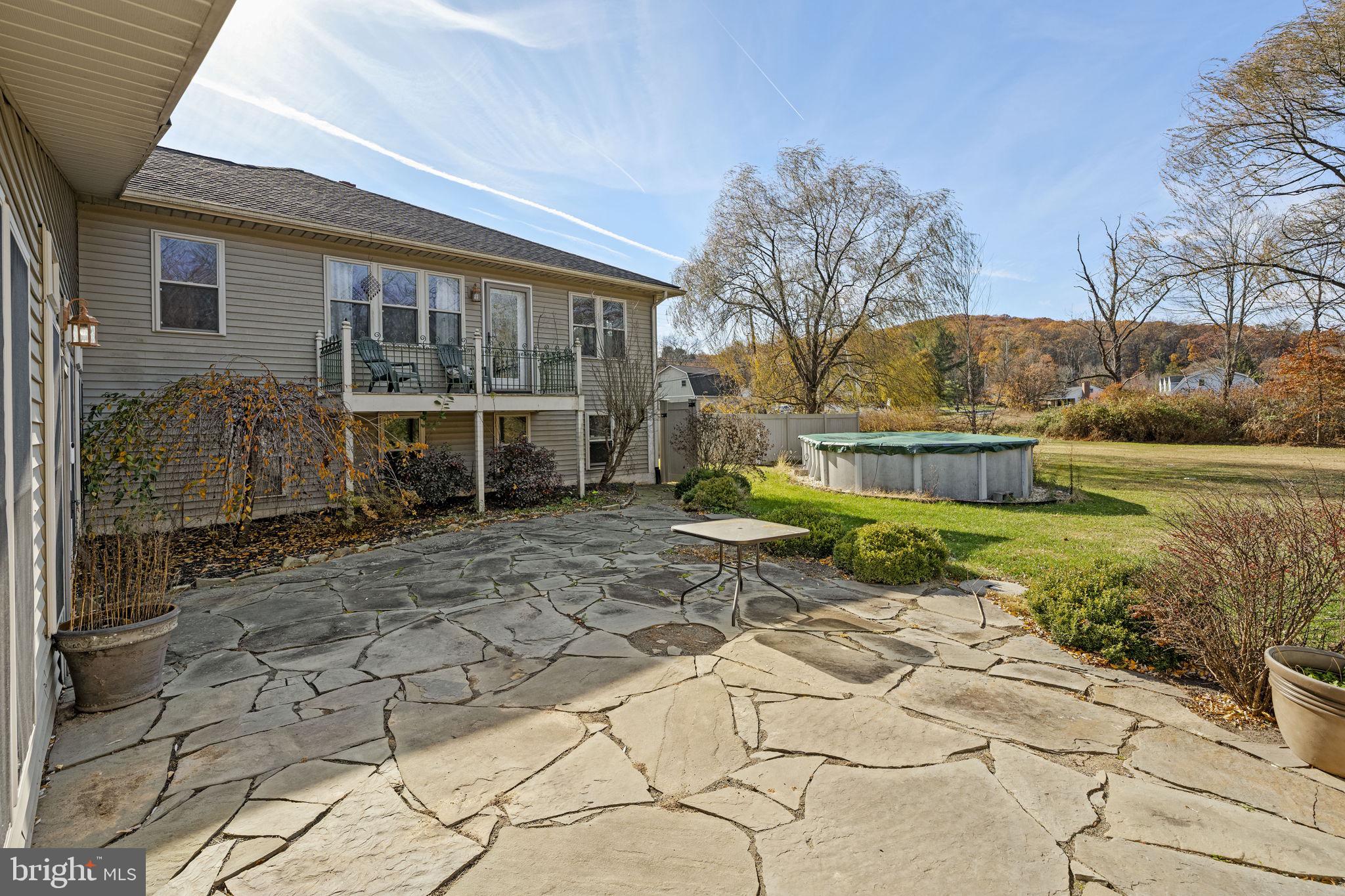 451 Pine Swamp Road Elverson, PA 19520 - Photo 71 of 91 a view of a house with backyard and sitting area