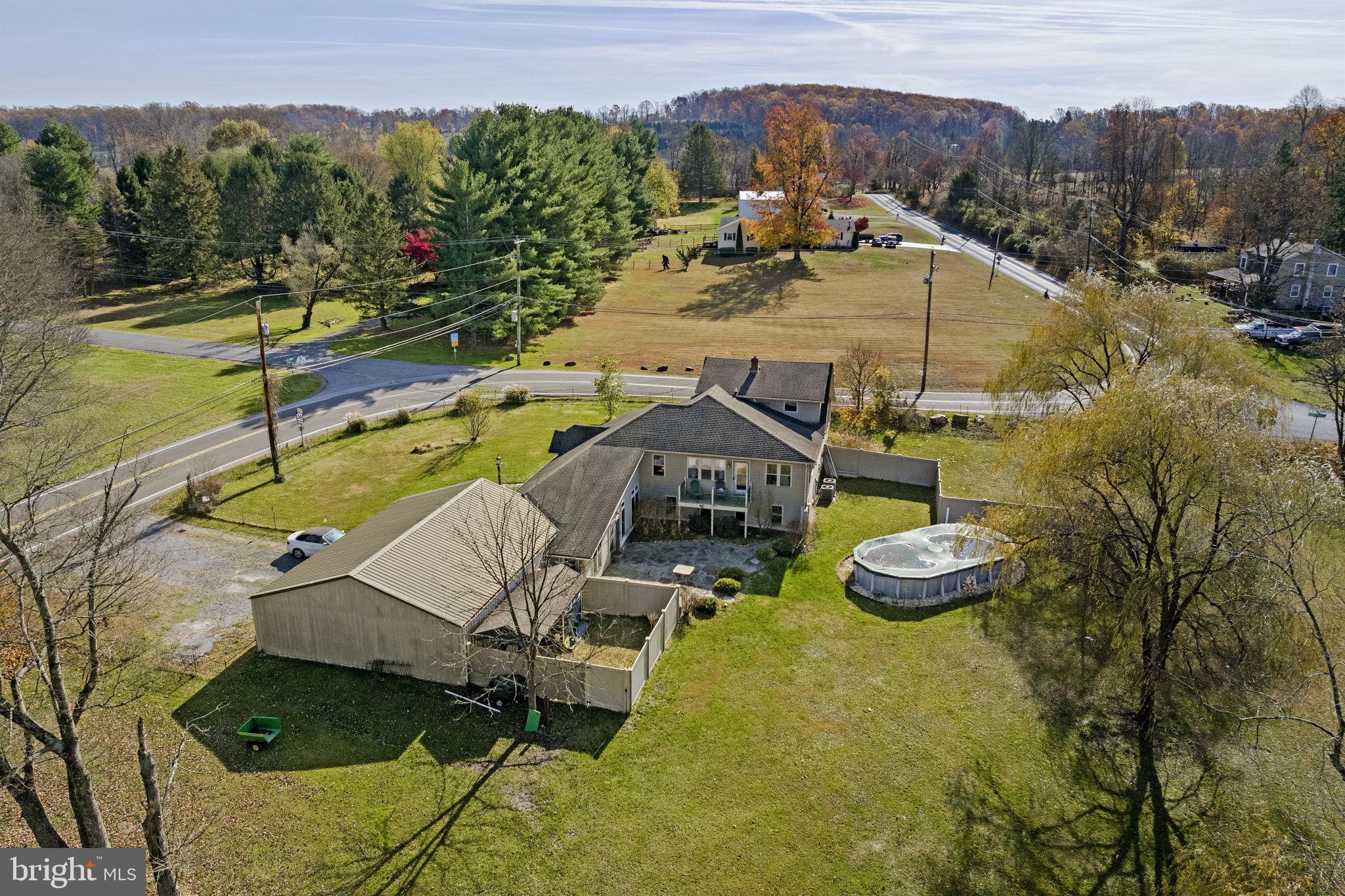451 Pine Swamp Road Elverson, PA 19520 - Photo 76 of 91 a view of a swimming pool with lounge chair