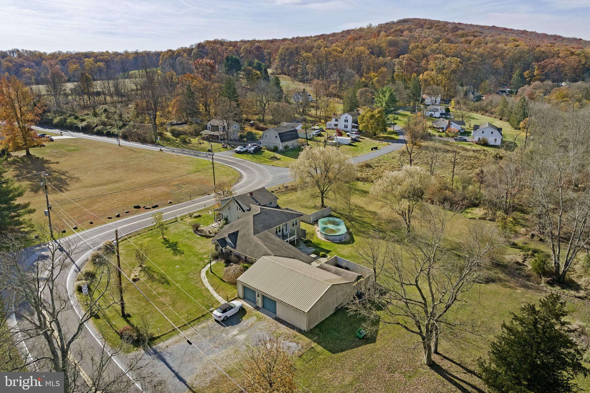 451 Pine Swamp Road Elverson, PA 19520 - Photo 77 of 91 a view of a swimming pool with a mountain view