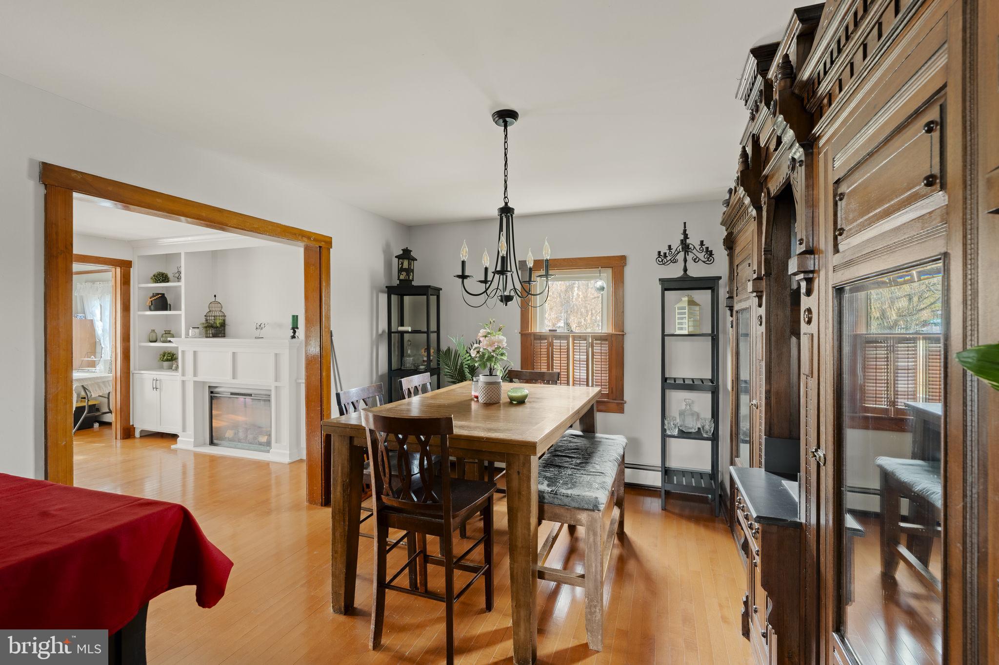 451 Pine Swamp Road Elverson, PA 19520 - Photo 8 of 91 a view of a dining room with furniture and a chandelier