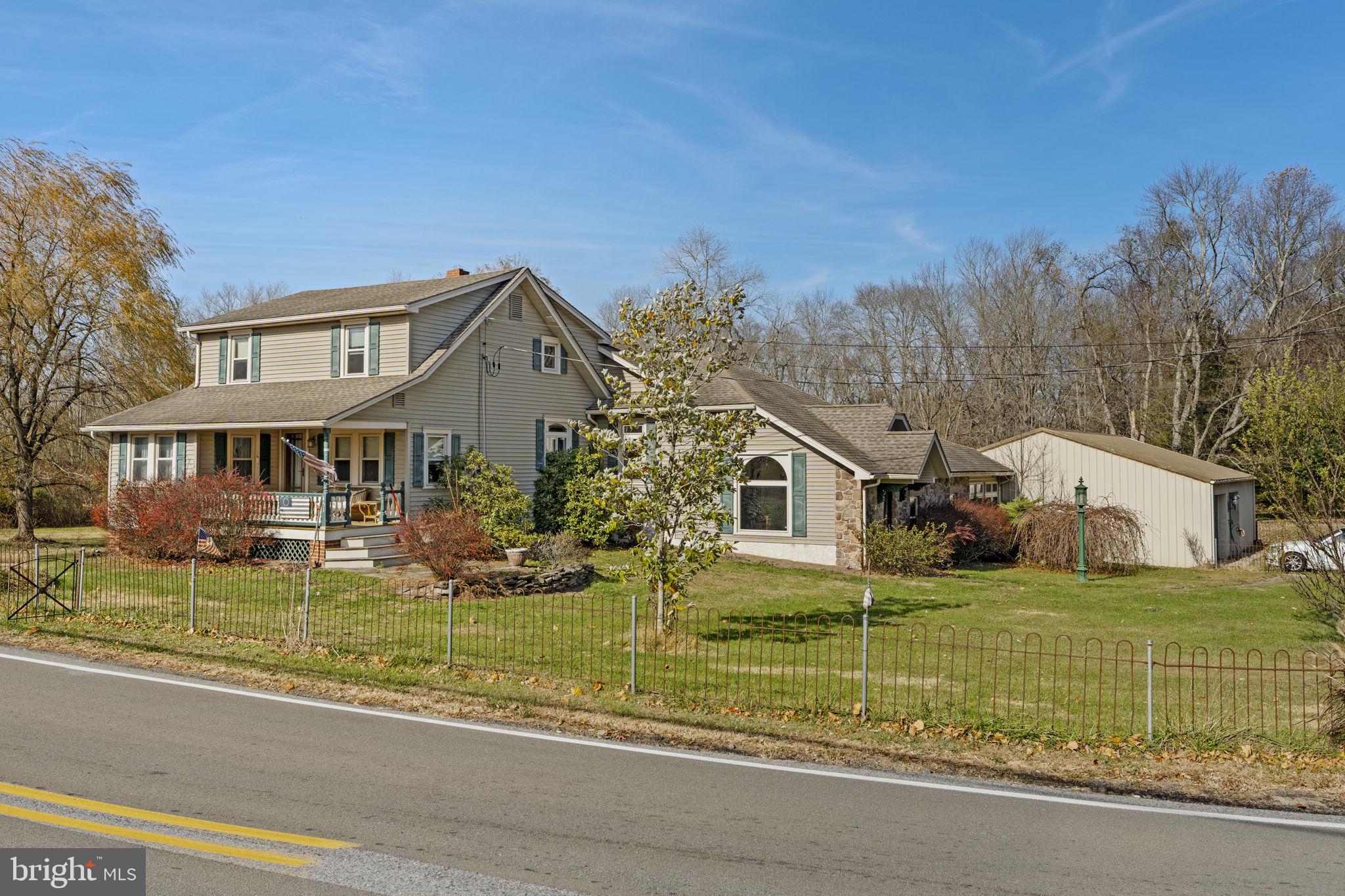 451 Pine Swamp Road Elverson, PA 19520 - Photo 81 of 91 a front view of a house with a yard