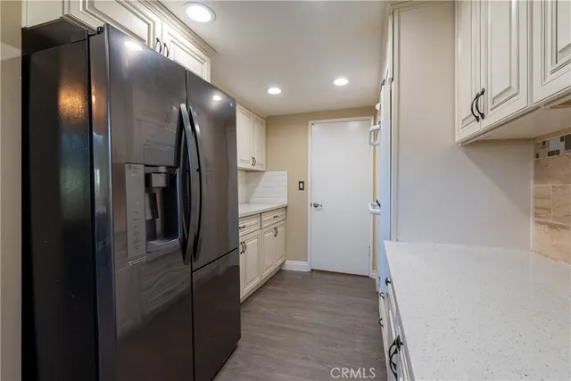 a view of hallway with cabinets