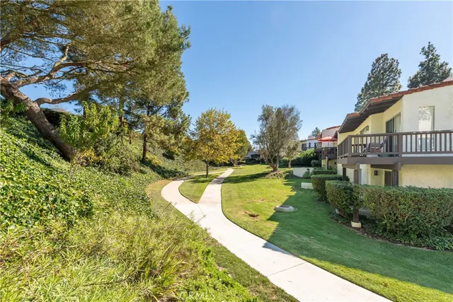 a view of a swimming pool with a yard